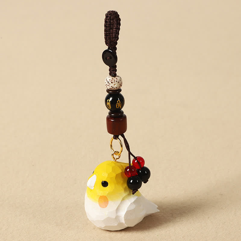 Buddha Stones Handgeschnitzte Schlüsselanhänger aus Naturholz mit Nymphensittichmotiv und den Aufschriften „Om Mani Padme Hum Focus“ - Nymphensittich Om Mani Padme Hum - image 0