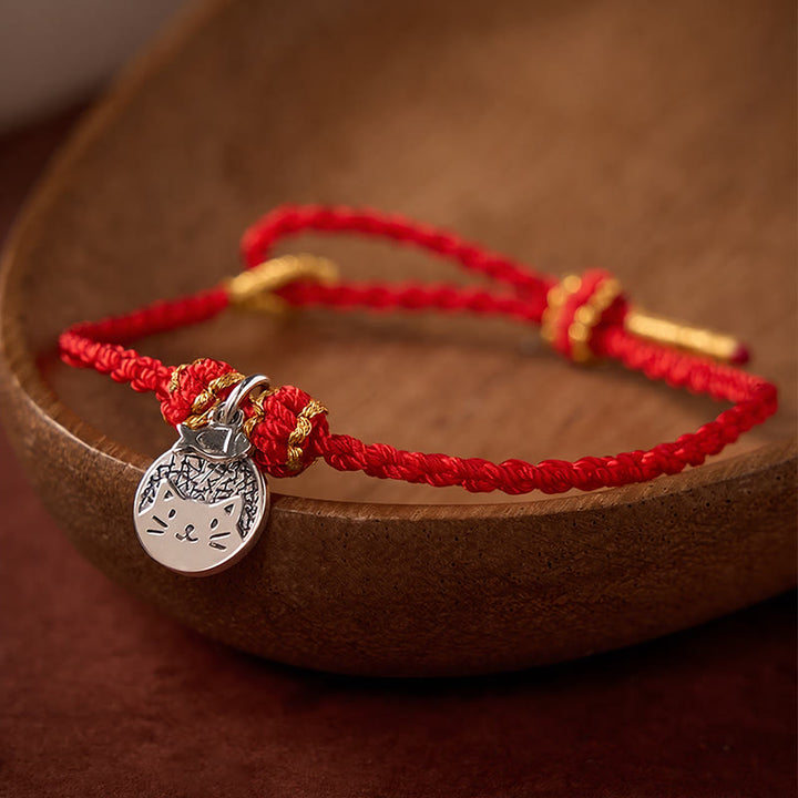 Buddha Stones Runder Anhänger aus 925er Sterlingsilber mit Kätzchen, das einen Fisch frisst, und passendes Armband aus geflochtenem Band (rot/schwarz) – ein Symbol für Wohlstand. - image 1