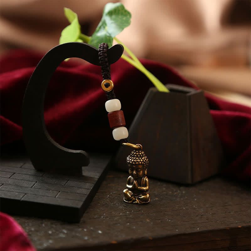 Buddha Stones Schlüsselanhänger aus Messing mit Buddha-Motiv, fünf Kaisermünzen und geflochtener Kordel (Symbol des Mitgefühls) - image 4
