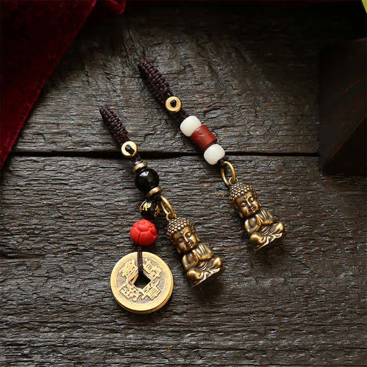 Buddha Stones Schlüsselanhänger aus Messing mit Buddha-Motiv, fünf Kaisermünzen und geflochtener Kordel (Symbol des Mitgefühls) - image 0