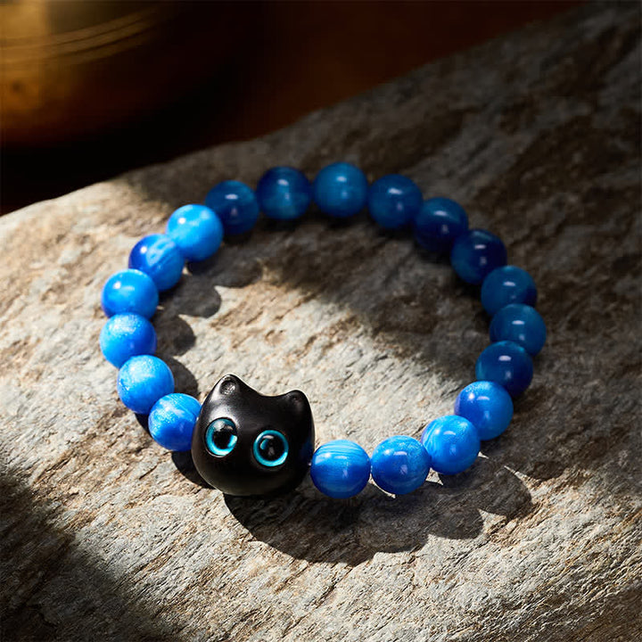 Buddha Stones Balance-Armband aus blauen Harzperlen und Ebenholz mit Katzenmotiv - image 12