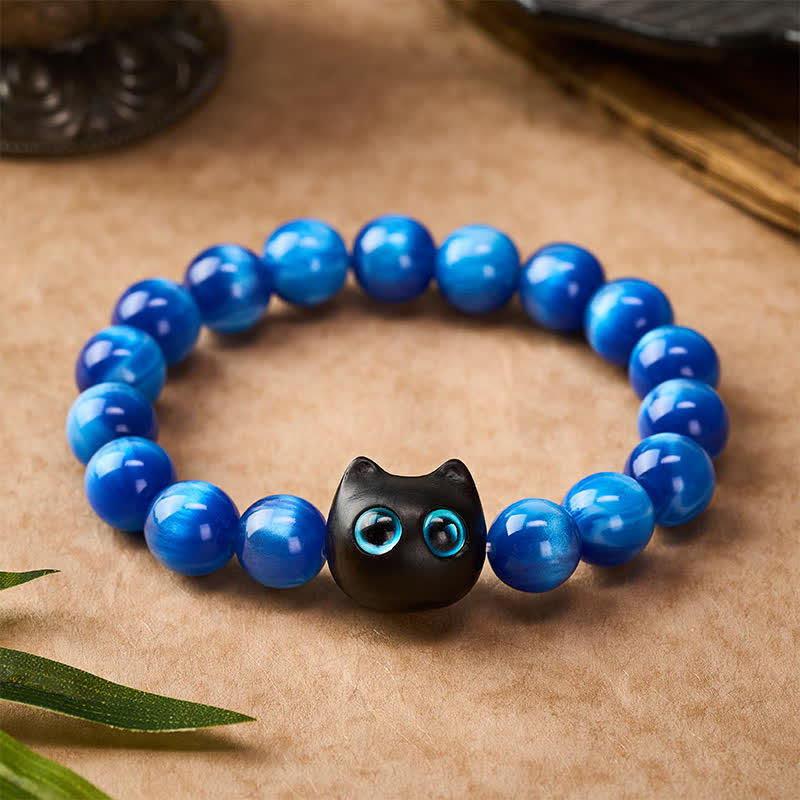 Buddha Stones Balance-Armband aus blauen Harzperlen und Ebenholz mit Katzenmotiv - image 1