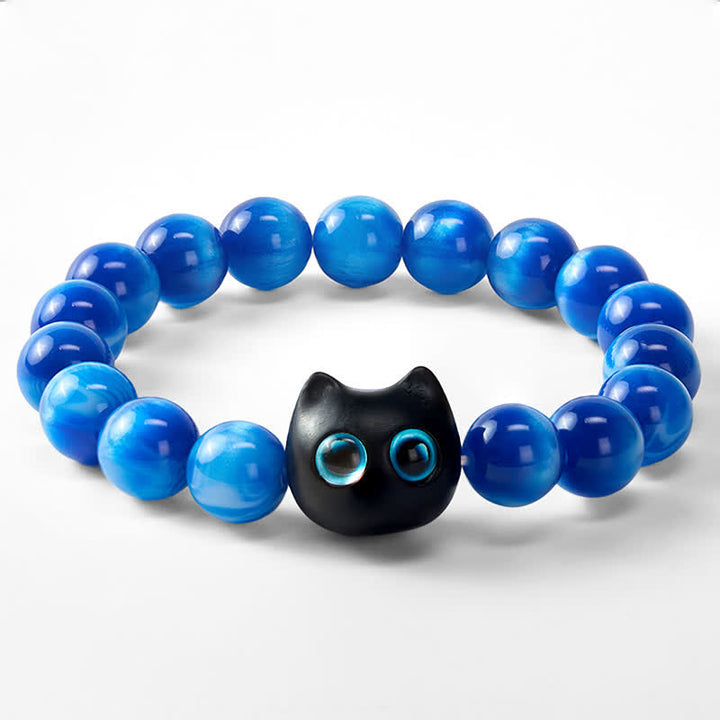 Buddha Stones Balance-Armband aus blauen Harzperlen und Ebenholz mit Katzenmotiv - image 6