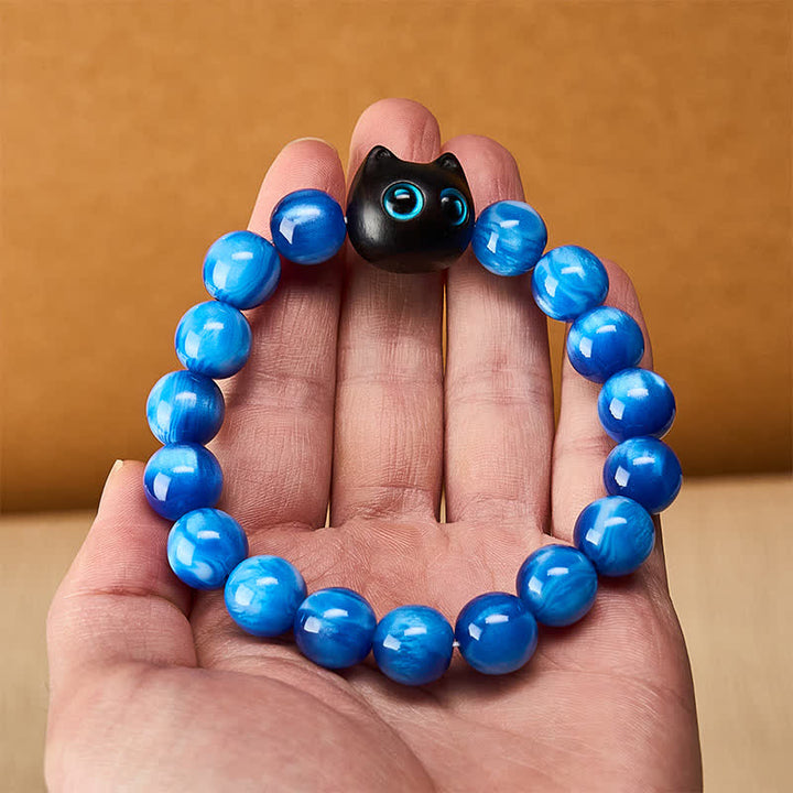 Buddha Stones Balance-Armband aus blauen Harzperlen und Ebenholz mit Katzenmotiv - image 5