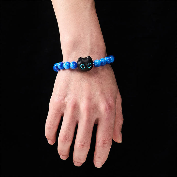 Buddha Stones Balance-Armband aus blauen Harzperlen und Ebenholz mit Katzenmotiv - image 13