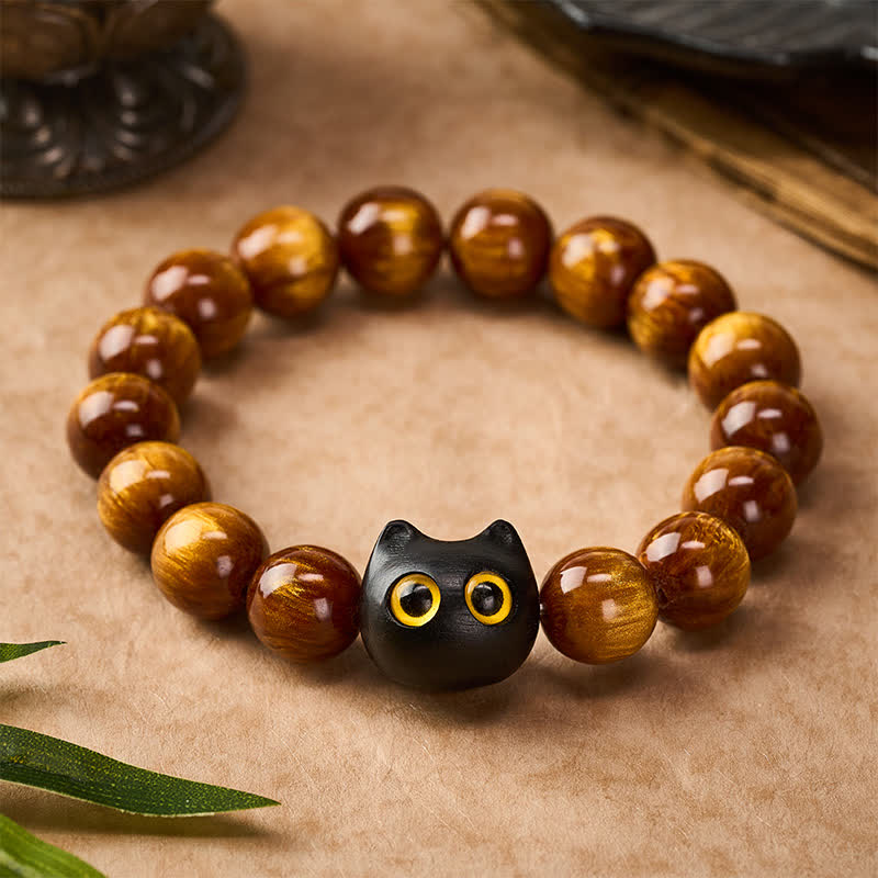Buddha Stones Armband mit gelben Harzperlen, gelben Augen und Katzenmotiv aus Ebenholz - image 1