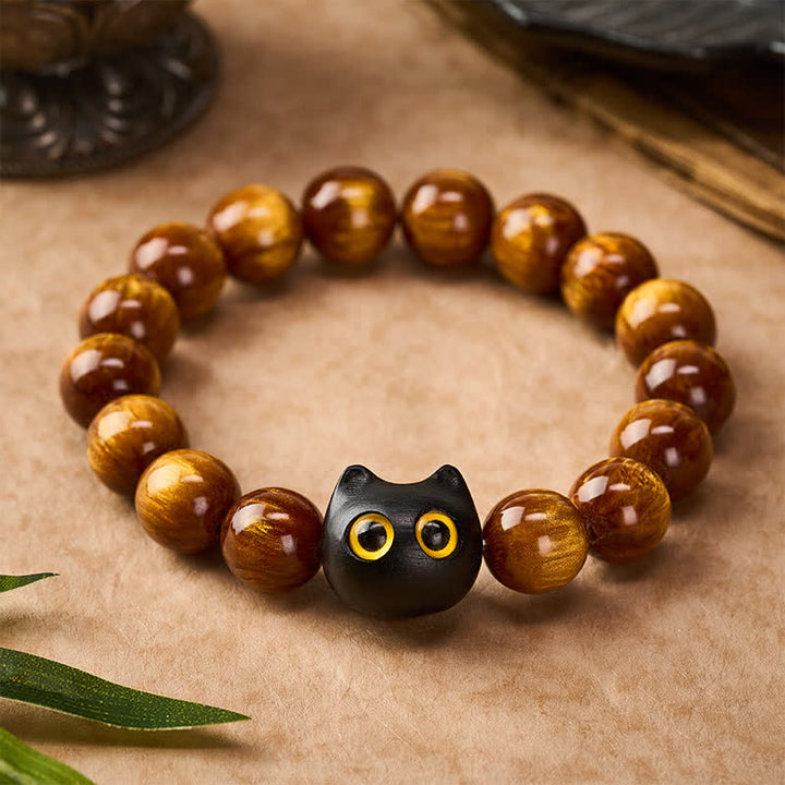 Buddha Stones Armband mit gelben Harzperlen, gelben Augen und Katzenmotiv aus Ebenholz - image 1