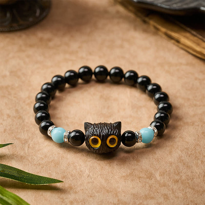 Buddha Stones Armband aus schwarzem Obsidian und weißem Chalcedon mit Katzenkopf-Reinheitsperle und großen Augen - image 22
