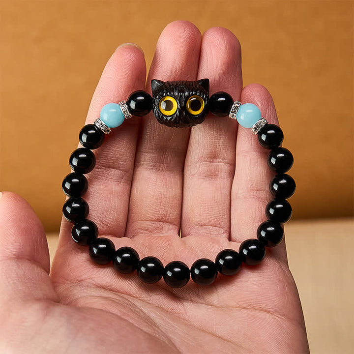 Buddha Stones Armband aus schwarzem Obsidian und weißem Chalcedon mit Katzenkopf-Reinheitsperle und großen Augen - image 20