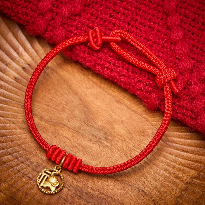 Buddha Stones Elefanten-Fu-Charakter, vergoldetes Kupfer-Rot-Faden-Armband - image 1