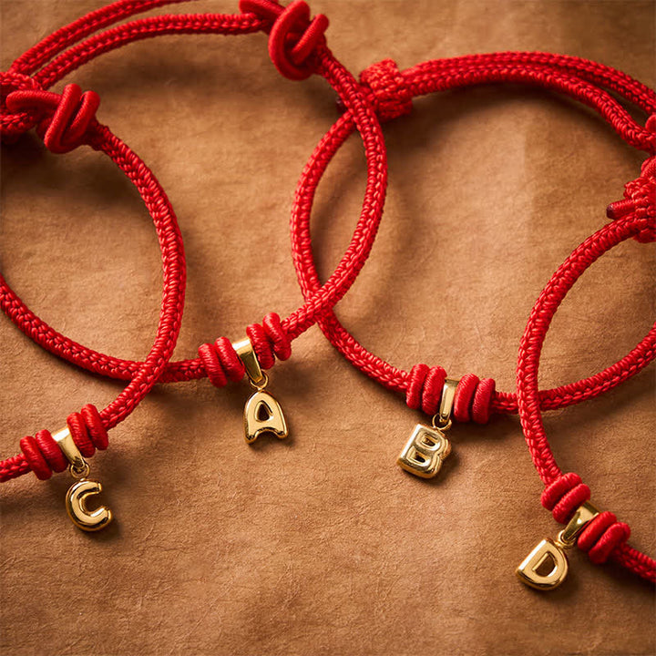 Buddha Stones Armband aus Titanstahl mit rotem Faden und Buchstaben - image 0