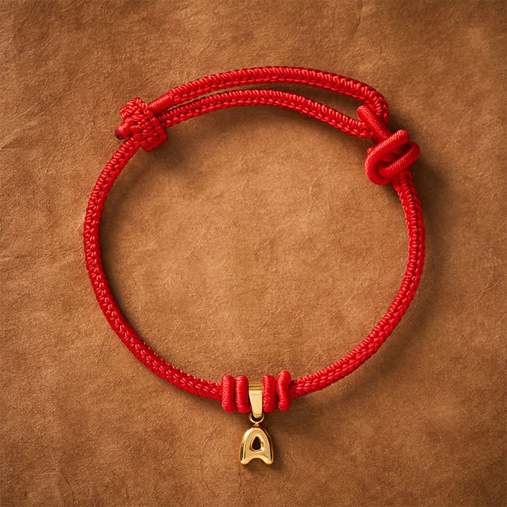 Buddha Stones Armband aus Titanstahl mit rotem Faden und Buchstaben - A - 6,7–7,5 Zoll (17–19 cm) - image 1