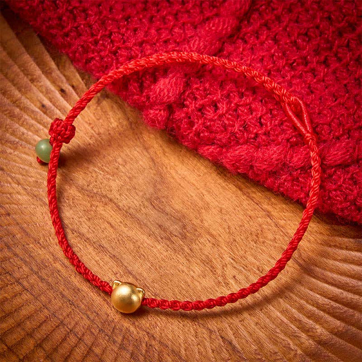 Buddha Stones Armband mit Katzenkopf aus Kupfer, Jade und roter Schnurverbindung - image 1