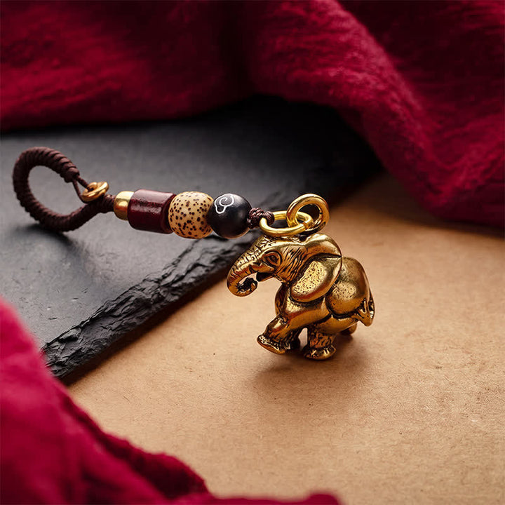 Buddha Stones Vintage Schlüsselanhänger mit Elefantenmotiv aus Messing und fünf Kaisermünzen als Glücksbringer - image 1