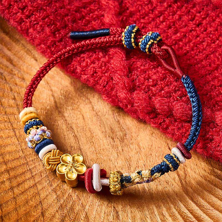 Buddha Stones Handgewebtes Armband aus rotem und marineblauem Garn mit Pfirsichblütenmuster - image 1