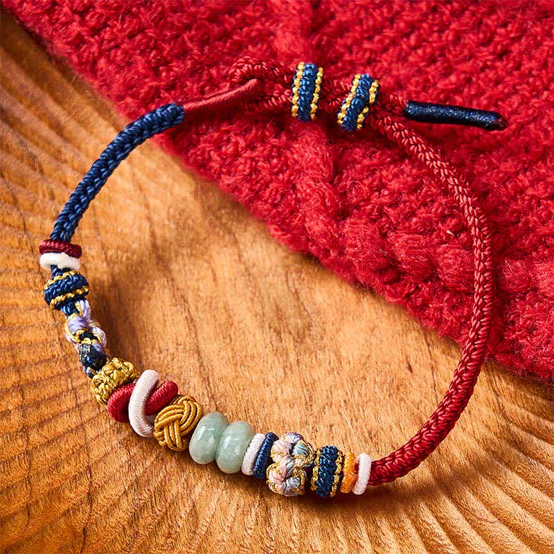 Buddha Stones Handgewebtes Armband aus pfirsichblütenförmigen Glücksjadeperlen in Rot und Marineblau - image 1