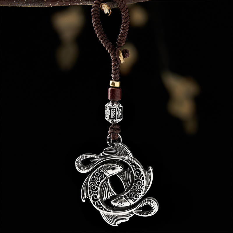 Buddha Stones Vintage-Schlüsselanhänger aus Kupfer mit Doppel-Koi-Fisch-Motiv und Symbol der Entschlossenheit - image 1