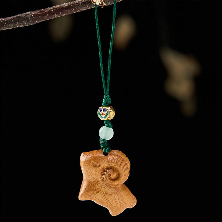 Buddha Stones Handgeschnitzte Schlüsselanhänger aus Sandelholz mit Ziegenmotiv - image 9