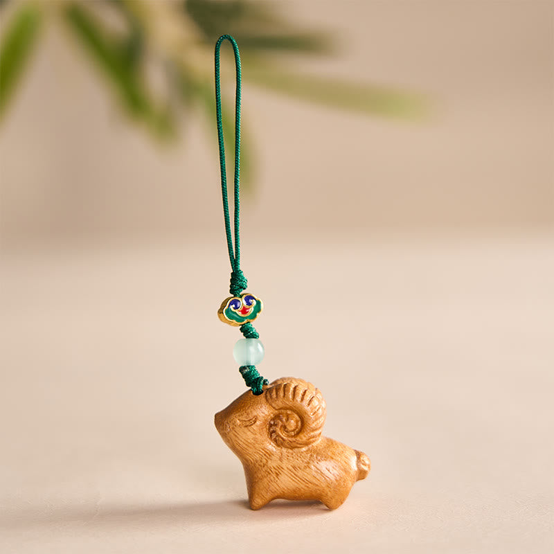 Buddha Stones Handgeschnitzte Schlüsselanhänger aus Sandelholz mit Ziegenmotiv - Gelb - image 7
