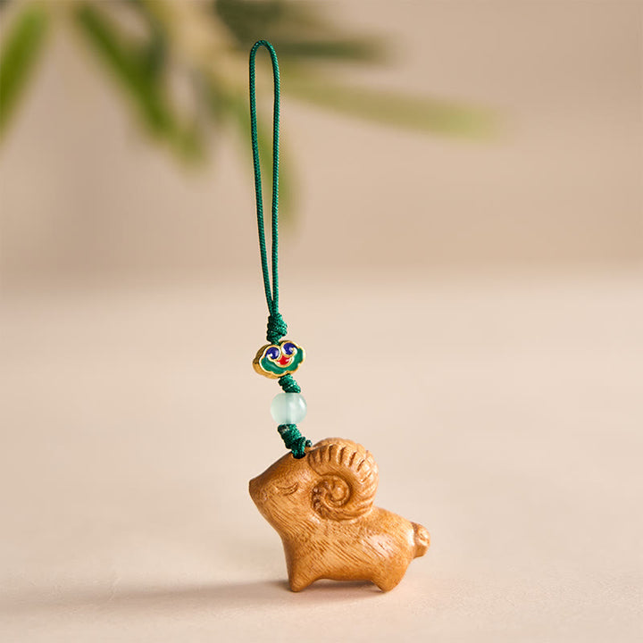 Buddha Stones Handgeschnitzte Schlüsselanhänger aus Sandelholz mit Ziegenmotiv - Gelb - image 7