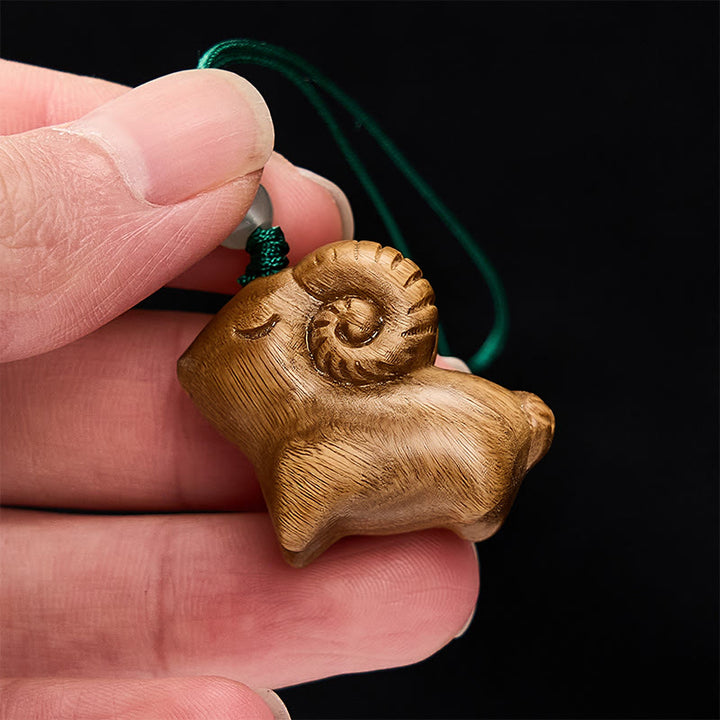Buddha Stones Handgeschnitzte Schlüsselanhänger aus Sandelholz mit Ziegenmotiv - image 4