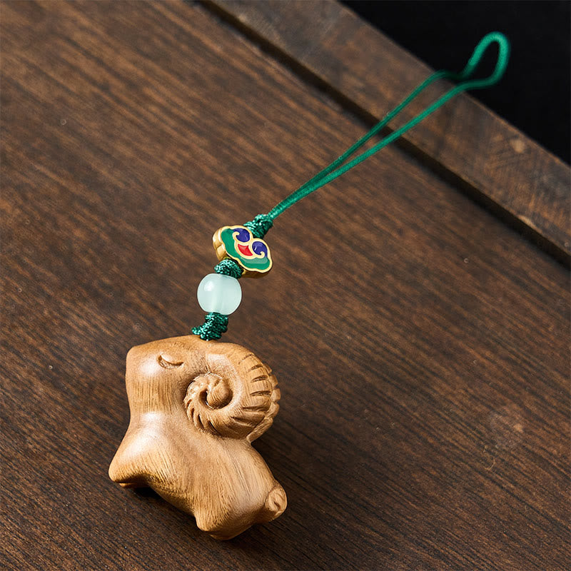 Buddha Stones Handgeschnitzte Schlüsselanhänger aus Sandelholz mit Ziegenmotiv - image 10