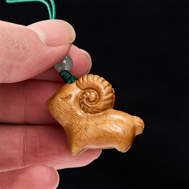 Buddha Stones Handgeschnitzte Schlüsselanhänger aus Sandelholz mit Ziegenmotiv - image 12