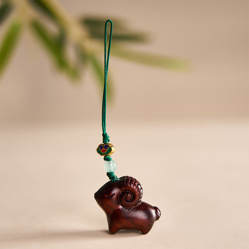 Buddha Stones Handgeschnitzte Schlüsselanhänger aus Sandelholz mit Ziegenmotiv - Dunkelrot - image 14