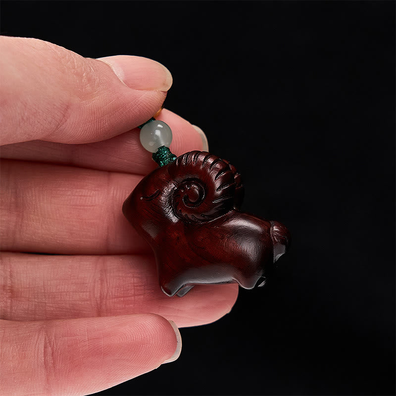 Buddha Stones Handgeschnitzte Schlüsselanhänger aus Sandelholz mit Ziegenmotiv - image 19