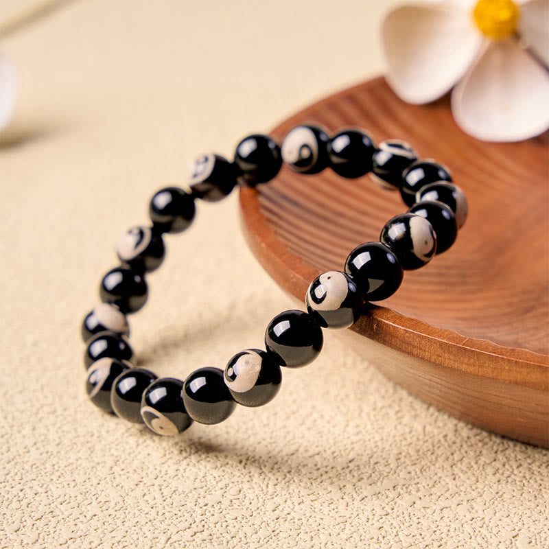 Buddha Stones Balance-Armband aus schwarzen Onyx-Yin-Yang-Perlen - image 1