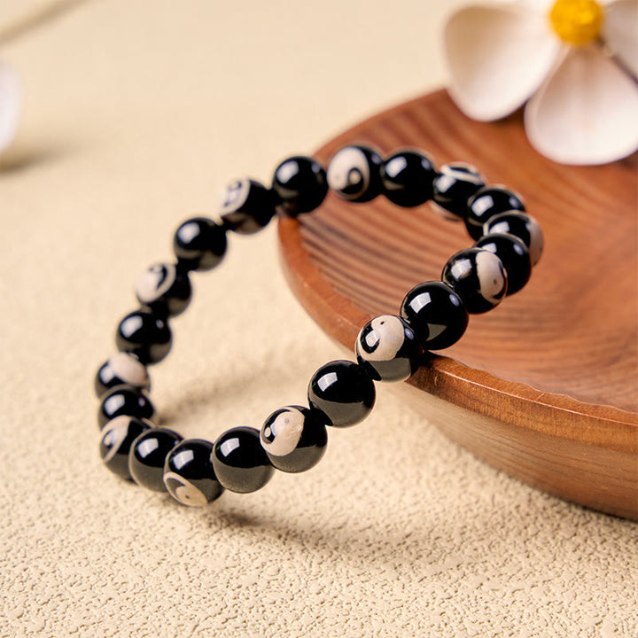 Buddha Stones Balance-Armband aus schwarzen Onyx-Yin-Yang-Perlen - image 1