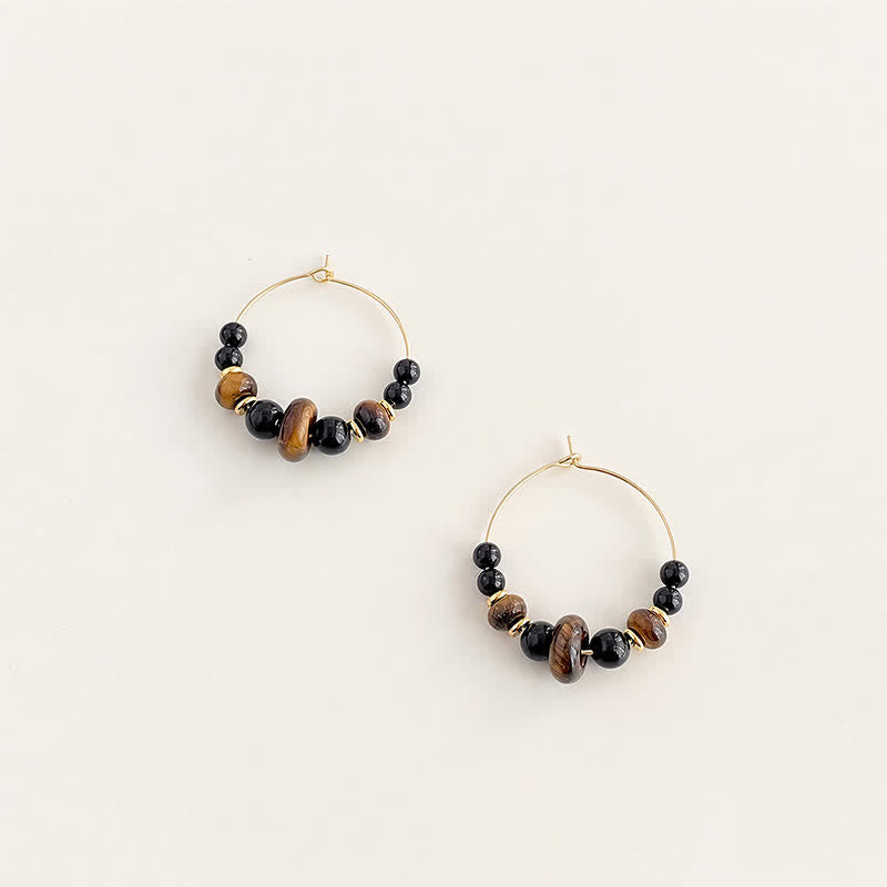 Buddha Stones Schwarze Onyx-Tigeraugen-Schutz-Creolen - image 1