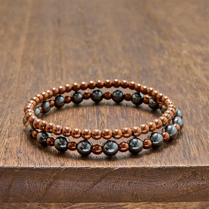 Buddha Stones 2-teiliges Set: Minimalistisches Armband aus runden Hämatitperlen für mehr Erdung - 2-teiliges Set (Handgelenkumfang: 14–15 cm) - image 0