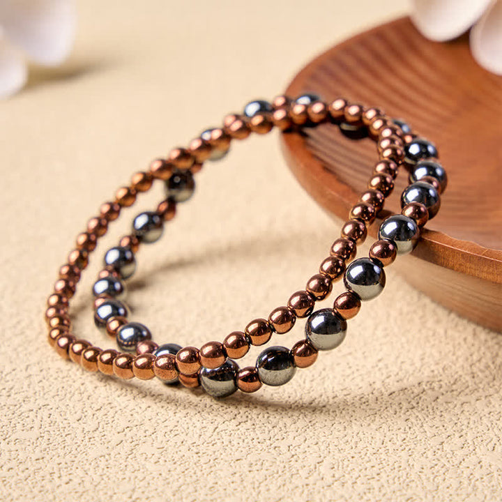 Buddha Stones 2-teiliges Set: Minimalistisches Armband aus runden Hämatitperlen für mehr Erdung - image 3