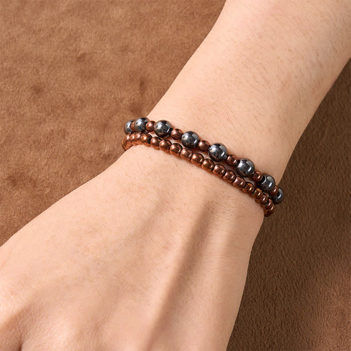 Buddha Stones 2-teiliges Set: Minimalistisches Armband aus runden Hämatitperlen für mehr Erdung - image 4
