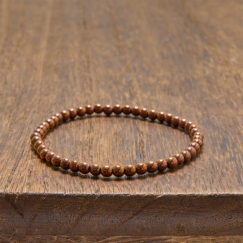 Buddha Stones 2-teiliges Set: Minimalistisches Armband aus runden Hämatitperlen für mehr Erdung - image 9