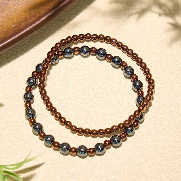 Buddha Stones 2-teiliges Set: Minimalistisches Armband aus runden Hämatitperlen für mehr Erdung - image 2