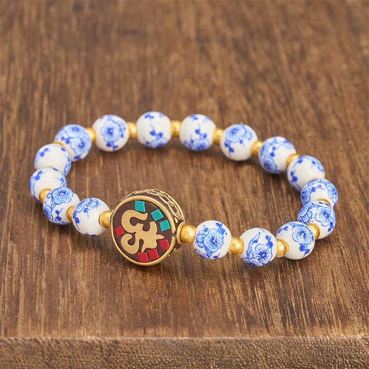 Buddha Stones Armband aus blau-weißem Porzellan und Kupfer mit OM-Gliedern der Bar. - image 1
