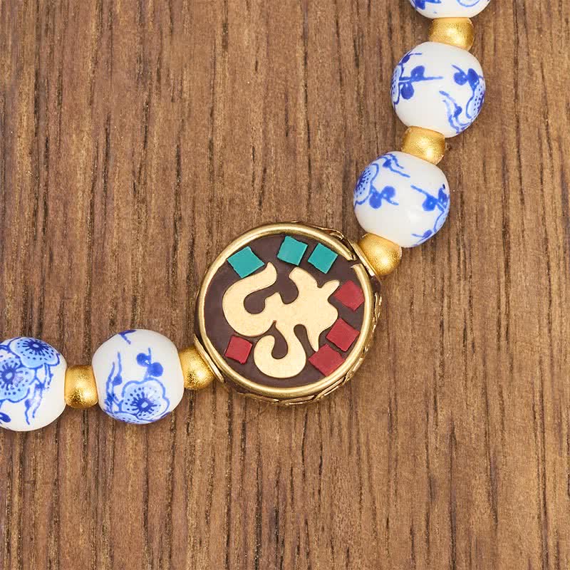 Buddha Stones Armband aus blau-weißem Porzellan und Kupfer mit OM-Gliedern der Bar. - image 4