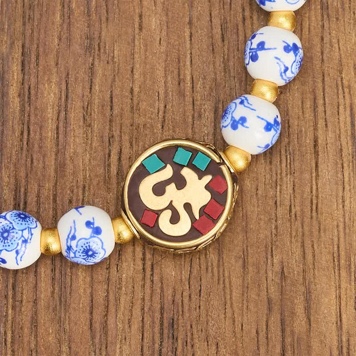 Buddha Stones Armband aus blau-weißem Porzellan und Kupfer mit OM-Gliedern der Bar. - image 4