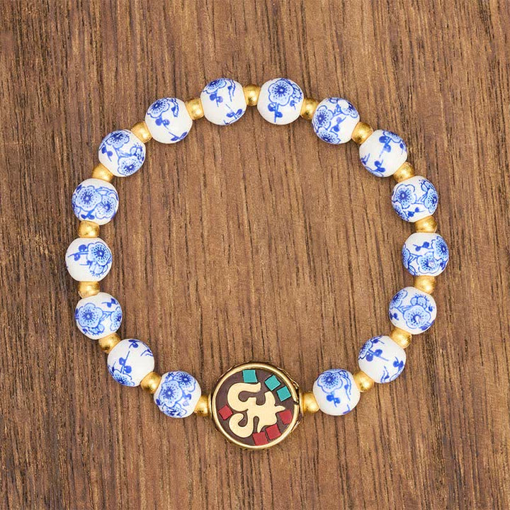 Buddha Stones Armband aus blau-weißem Porzellan und Kupfer mit OM-Gliedern der Bar. - image 2