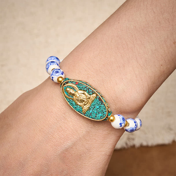 Buddha Stones Armband mit Buddha-Motiv aus weißem Porzellan, blauen floralen Perlen und runden Perlen - image 2