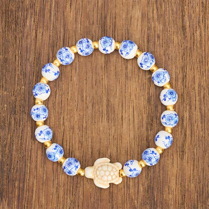 Buddha Stones Armband aus blau-weißem Porzellan mit Schildkrötenmotiv – Symbol für Reinheit und Langlebigkeit - image 1