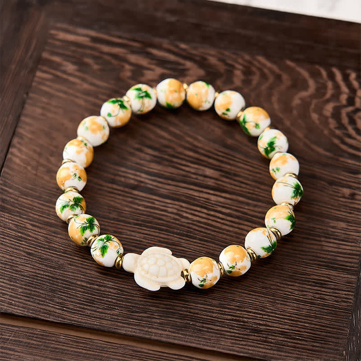 Buddha Stones Natürliches weißes Türkis-Armband mit Schildkrötenmotiv - image 1