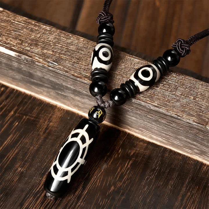 Buddha Stones Halskettenanhänger aus tibetischem schwarzem Onyx mit Schildpattmuster – Schutz und Segen - image 1