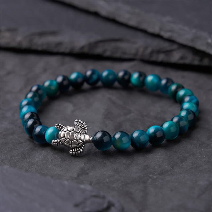 Buddha Stones Kraftvolles Armband aus blauem Tigerauge-Kupfer mit Schildkrötenmotiv - image 1