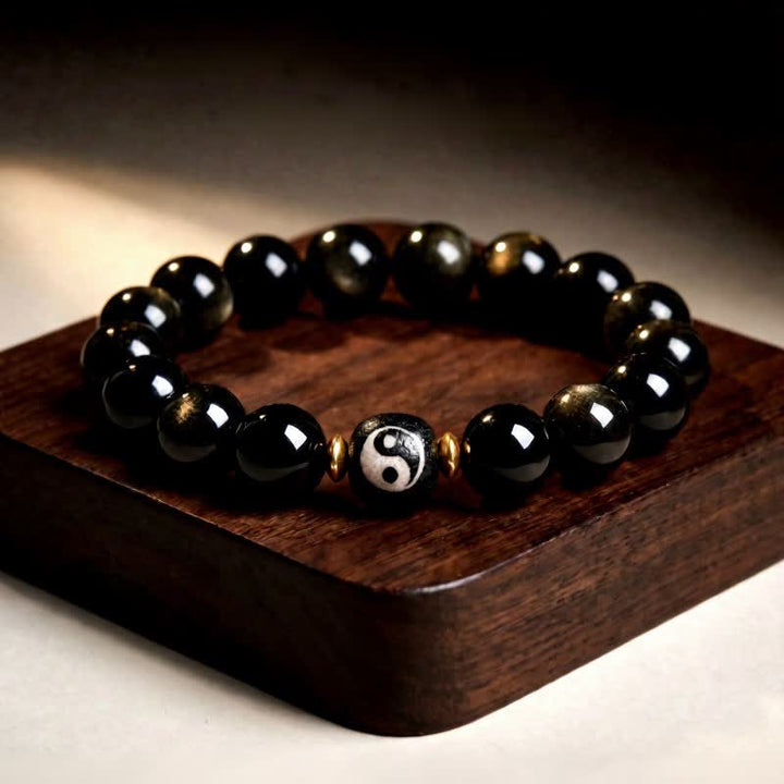 Buddha Stones Armband aus goldenem Obsidian mit Yin-Yang-Symbol für Schutz und Balance - Goldglänzender Obsidian - 12 mm (6,7–7,1 Zoll/17–18 cm) - image 0