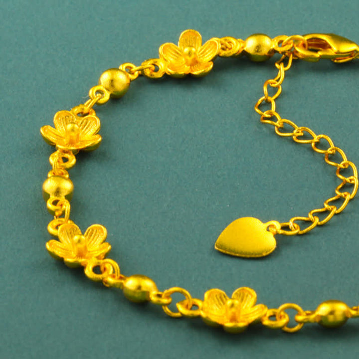Buddha Stones Armband aus vergoldetem Messing mit Herzanhänger und Pfirsichblütenmotiv - image 3