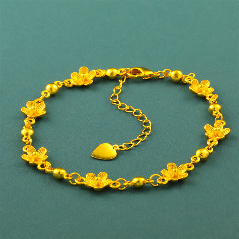 Buddha Stones Armband aus vergoldetem Messing mit Herzanhänger und Pfirsichblütenmotiv - image 1