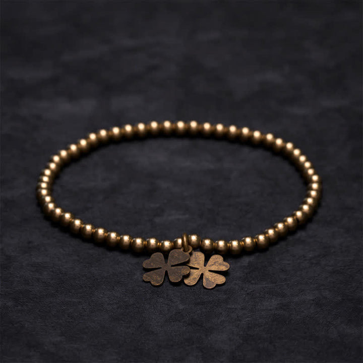 Buddha Stones Glücksarmband mit Kupferperlen und vierblättrigem Kleeblatt-Anhänger - image 1